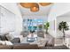 Bright living room featuring waterfront views, modern lighting fixtures, and stylish decor at 517 Belle Isle Ave, Belleair Beach, FL 33786