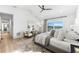 Inviting primary bedroom boasts a water view, ceiling fan and decorative rug at 517 Belle Isle Ave, Belleair Beach, FL 33786