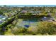 Aerial view of well-maintained tennis courts in a lush, green community, perfect for active living at 517 Belle Isle Ave, Belleair Beach, FL 33786