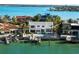 Gorgeous waterfront home with a private boat dock and backyard pool, perfect for luxurious coastal living at 517 Belle Isle Ave, Belleair Beach, FL 33786