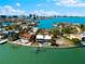 Wonderful waterfront home with a private pool and dock, providing a stunning view of the bay and skyline at 520 Belle Isle Ave, Belleair Beach, FL 33786