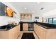 The well-appointed bar area features granite countertops, ample cabinet space, and a wine cooler for entertaining at 520 Belle Isle Ave, Belleair Beach, FL 33786