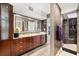 Beautiful bathroom with a glass shower, marble wall, and custom vanity at 520 Belle Isle Ave, Belleair Beach, FL 33786