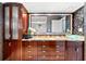 Stunning bathroom vanity with granite countertops, vessel sink, and ample storage at 520 Belle Isle Ave, Belleair Beach, FL 33786