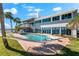 Enjoy waterfront living at its finest with an outdoor pool, hammock, and spacious deck at 520 Belle Isle Ave, Belleair Beach, FL 33786