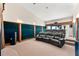 Lavish home theater features plush seating, tiered levels, and acoustic panels for an immersive experience at 520 Belle Isle Ave, Belleair Beach, FL 33786