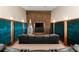Luxury home theater room featuring leather recliners, a large screen, and acoustic paneling for an immersive experience at 520 Belle Isle Ave, Belleair Beach, FL 33786