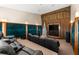 Stunning home theater room with black leather recliners, tiered seating, and custom lighting for a cinematic experience at 520 Belle Isle Ave, Belleair Beach, FL 33786