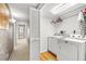 The laundry room with modern washer and dryer, and extra storage space at 520 Belle Isle Ave, Belleair Beach, FL 33786