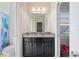 Bathroom featuring a vanity with granite countertop and a shower over tub at 6867 Citrus Creek Ln, Tampa, FL 33625