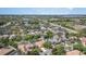 An aerial view captures the neighborhood, multiple ponds and landscaping at 7581 Palmer Glen Cir, Sarasota, FL 34240