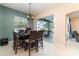Dining room with table, chairs, view of backyard and patio at 7581 Palmer Glen Cir, Sarasota, FL 34240