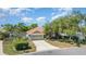 Charming single-story home with a tile roof, two-car garage, and well-maintained landscaping at 7581 Palmer Glen Cir, Sarasota, FL 34240