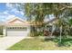 Charming single-story home with a two car garage and mature landscaping at 7581 Palmer Glen Cir, Sarasota, FL 34240