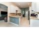 Bright kitchen featuring white cabinets, granite countertops, and tile backsplash at 7581 Palmer Glen Cir, Sarasota, FL 34240