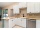 Kitchen with granite countertops, stainless steel appliances, and white cabinets at 7581 Palmer Glen Cir, Sarasota, FL 34240