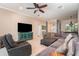 Spacious living room featuring tile flooring, comfortable seating, and a large open layout at 7581 Palmer Glen Cir, Sarasota, FL 34240