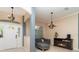 Inviting living room features tile floors, neutral paint, chandelier, and a cozy fireplace at 7581 Palmer Glen Cir, Sarasota, FL 34240
