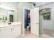 Main bathroom features tiled walk-in shower and vanity at 7581 Palmer Glen Cir, Sarasota, FL 34240