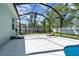 A screened-in patio features ample seating space and backyard views at 7581 Palmer Glen Cir, Sarasota, FL 34240