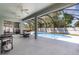 Inviting pool area with screened enclosure and multiple ceiling fans at 7581 Palmer Glen Cir, Sarasota, FL 34240