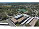 Aerial view showcases a residential complex near a serene lake, coastline and Madeira and Redington Beaches at 10038 62Nd N Ter # 21, St Petersburg, FL 33708