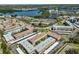 Aerial view of condo complex with lake views and mature landscaping in desirable location at 10038 62Nd N Ter # 21, St Petersburg, FL 33708