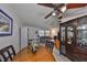 Dining room featuring a lovely vintage ceiling fan fixture and bright views of the living room at 10038 62Nd N Ter # 21, St Petersburg, FL 33708