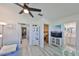 Open living area with neutral tones, light gray floors, and easy access to bathroom and bedroom at 10038 62Nd N Ter # 21, St Petersburg, FL 33708