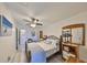 Main bedroom featuring a comfortable queen bed, matching furniture, and bright decor at 10038 62Nd N Ter # 21, St Petersburg, FL 33708