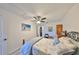 Bright main bedroom with queen bed, wood furniture, and stylish decor at 10038 62Nd N Ter # 21, St Petersburg, FL 33708