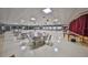 Large meeting room featuring tables, chairs, stage, and decorative accents at 10038 62Nd N Ter # 21, St Petersburg, FL 33708