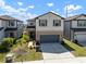 Charming two-story home featuring a well-manicured front yard and a two-car garage at 11415 Green Harvest Dr, Riverview, FL 33578