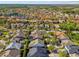 Expansive aerial shot of a housing community with lakes, showcasing harmonious urban planning and design at 14605 Chatsworth Manor Cir, Tampa, FL 33626