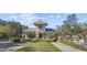 Elegant community entrance with manicured landscaping and a secure gatehouse offering a welcoming arrival at 14605 Chatsworth Manor Cir, Tampa, FL 33626