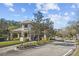 A secure gated entrance to a residential community with manicured landscaping and guard house at 14605 Chatsworth Manor Cir, Tampa, FL 33626