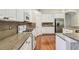 Updated kitchen with granite countertops, stainless steel appliances, and hardwood floors at 14605 Chatsworth Manor Cir, Tampa, FL 33626