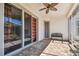 Covered patio with brick pavers offers seamless indoor-outdoor living at 14605 Chatsworth Manor Cir, Tampa, FL 33626