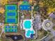 Aerial view of resort-style community amenities including pool, tennis, basketball, and playground at 14605 Chatsworth Manor Cir, Tampa, FL 33626