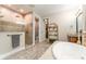 Bathroom featuring walk-in shower, dark wood vanity, and walk-in closet at 14610 Red Castle Ave, Lithia, FL 33547