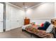 Bedroom featuring a ceiling fan and double door closet at 14610 Red Castle Ave, Lithia, FL 33547