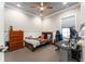 Cozy bedroom featuring a ceiling fan, wood dresser, neutral paint, and carpet flooring at 14610 Red Castle Ave, Lithia, FL 33547