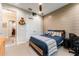 Bedroom features a ceiling fan, natural lighting, and a wood accent wall at 14610 Red Castle Ave, Lithia, FL 33547