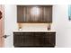Elegant built-in cabinets with drawers and countertop space, perfect for storage and organization at 14610 Red Castle Ave, Lithia, FL 33547