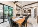 Dining room leading to the kitchen and living room with views of the outside pool and patio at 14610 Red Castle Ave, Lithia, FL 33547