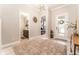 Inviting foyer featuring a decorative rug, stylish light fixture, and views of the bathroom and bedroom at 14610 Red Castle Ave, Lithia, FL 33547