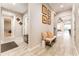 Wide hallway with tile flooring, decorative accents, and access to various rooms in the home at 14610 Red Castle Ave, Lithia, FL 33547