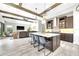Bright open kitchen with a marble island and stainless appliances that opens to the living room at 14610 Red Castle Ave, Lithia, FL 33547