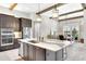 Open concept kitchen with a center island, stainless steel appliances, and an eat-in dining space at 14610 Red Castle Ave, Lithia, FL 33547