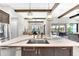 Modern kitchen island with stainless steel dishwasher and stainless steel sink at 14610 Red Castle Ave, Lithia, FL 33547